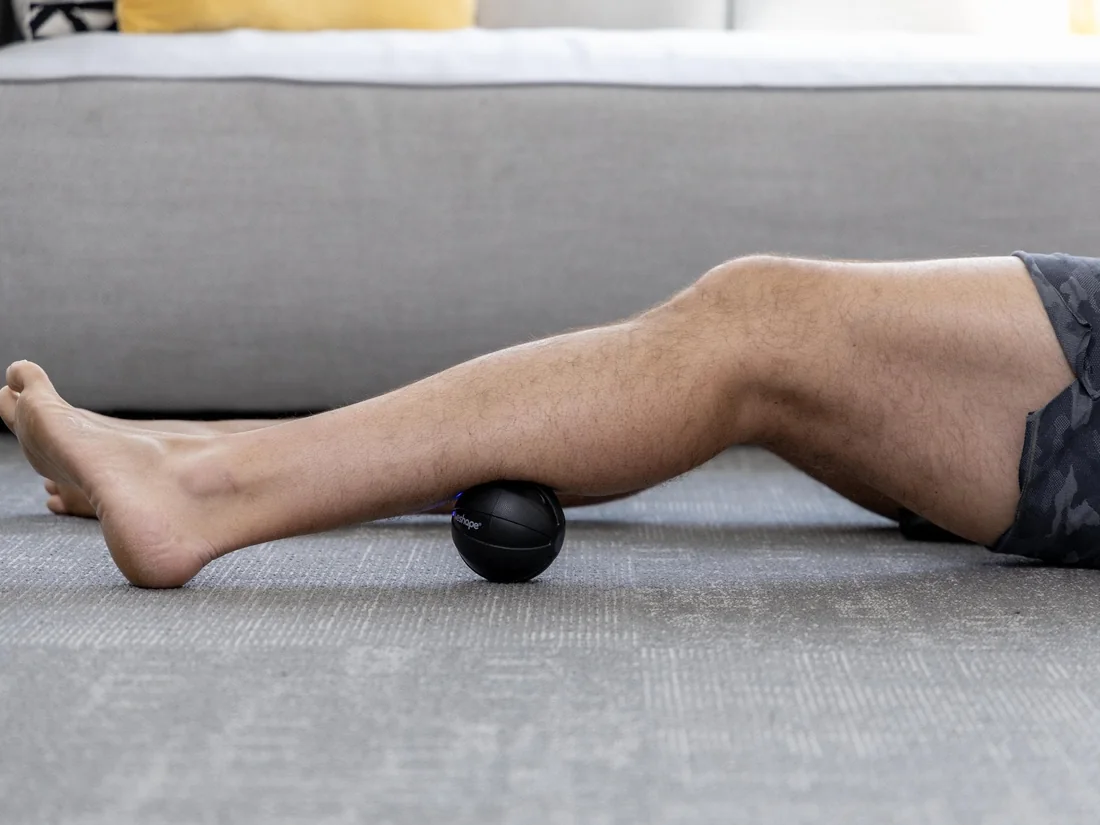 Rolling the calf on the WeRelease vibrating ball